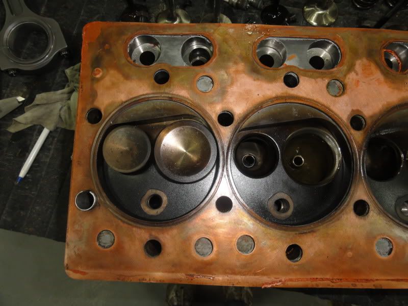 Piston dome design to poor spark plug placement Don